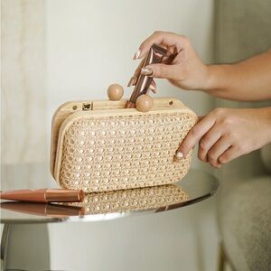 Tommy Bahama Cream Woven Clutch with Classic Silhouette